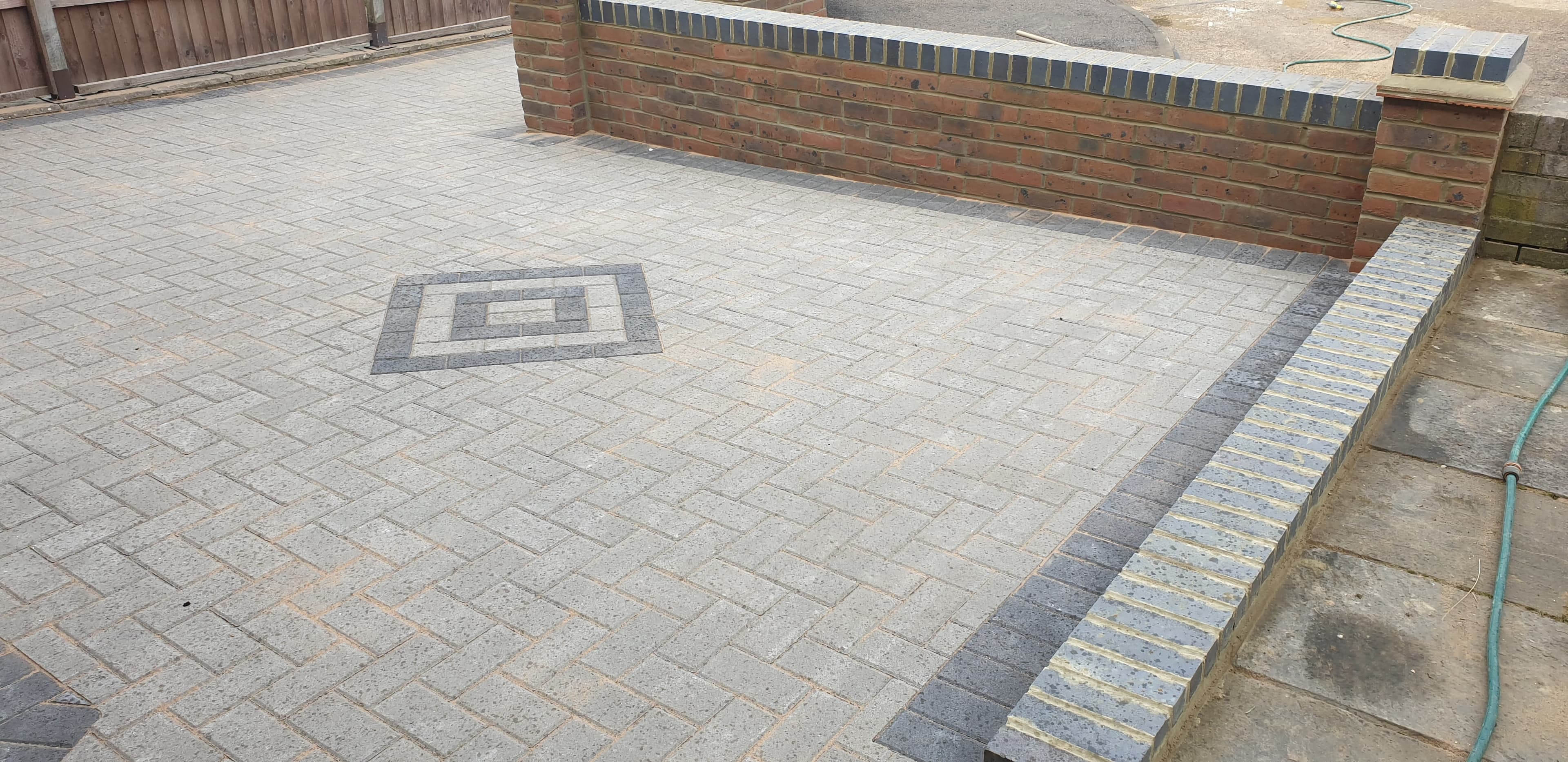 A freshly cleaned block paving driveway that has just been re-sanded.
